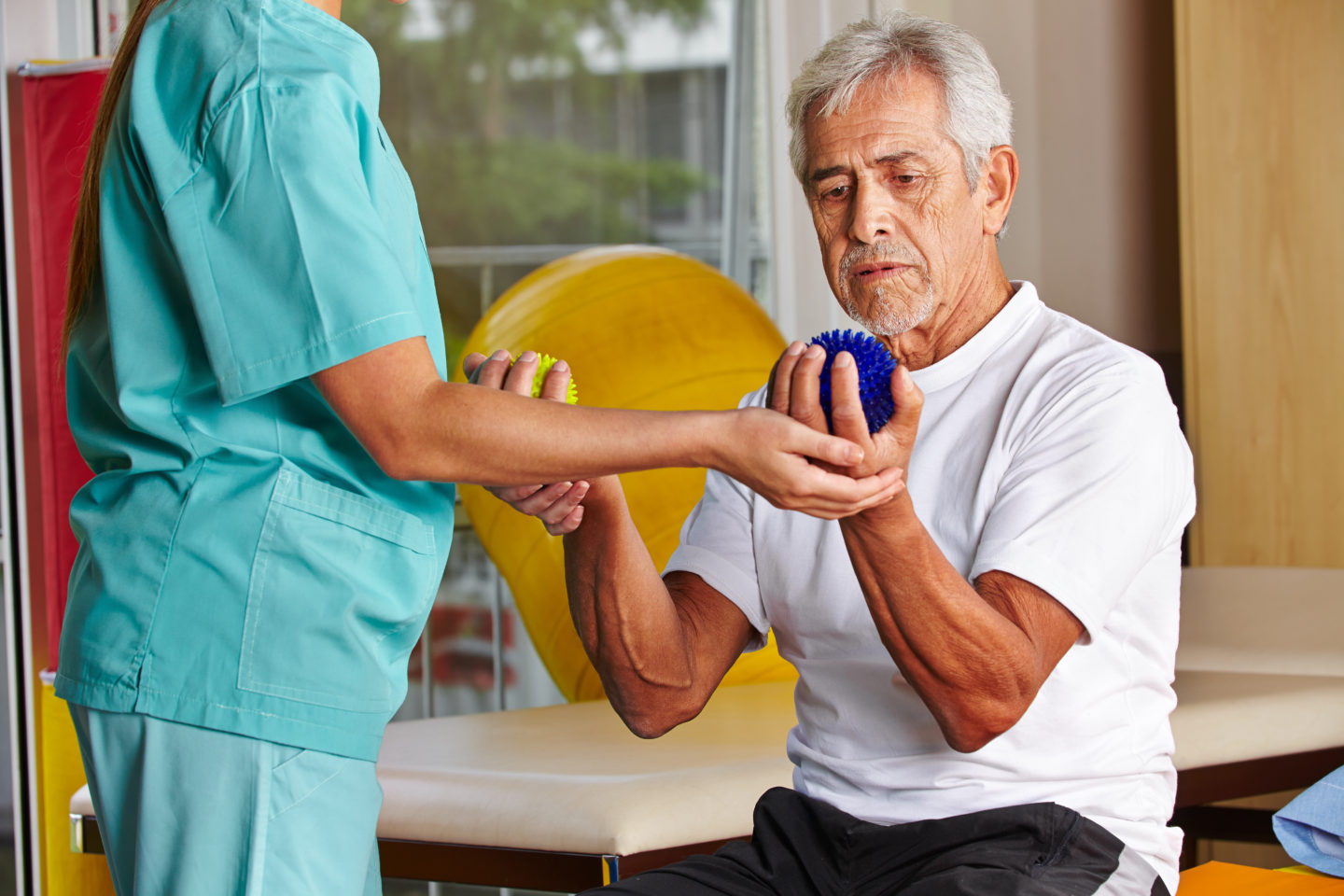 main doing occupational therapy with nurse
