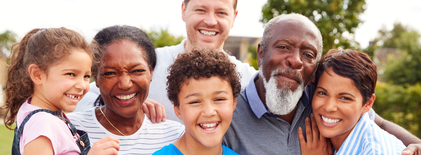 Multi-generational family enjoys time together outside.