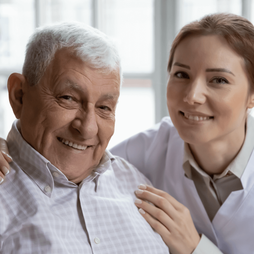 Home healthcare worker assists with older man.