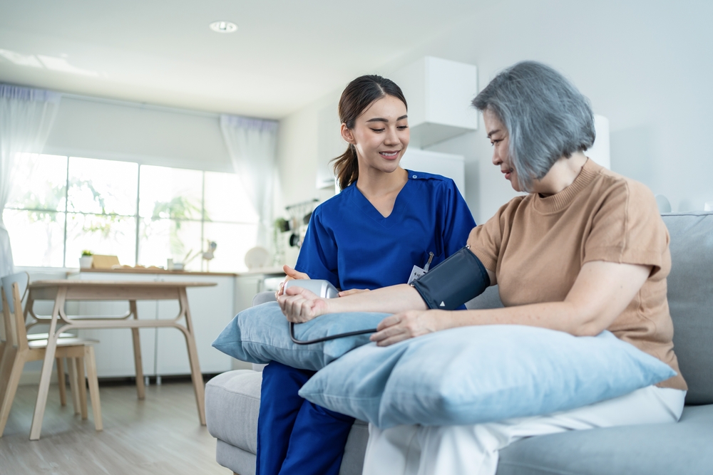 Woman receives care at home from registered nurse