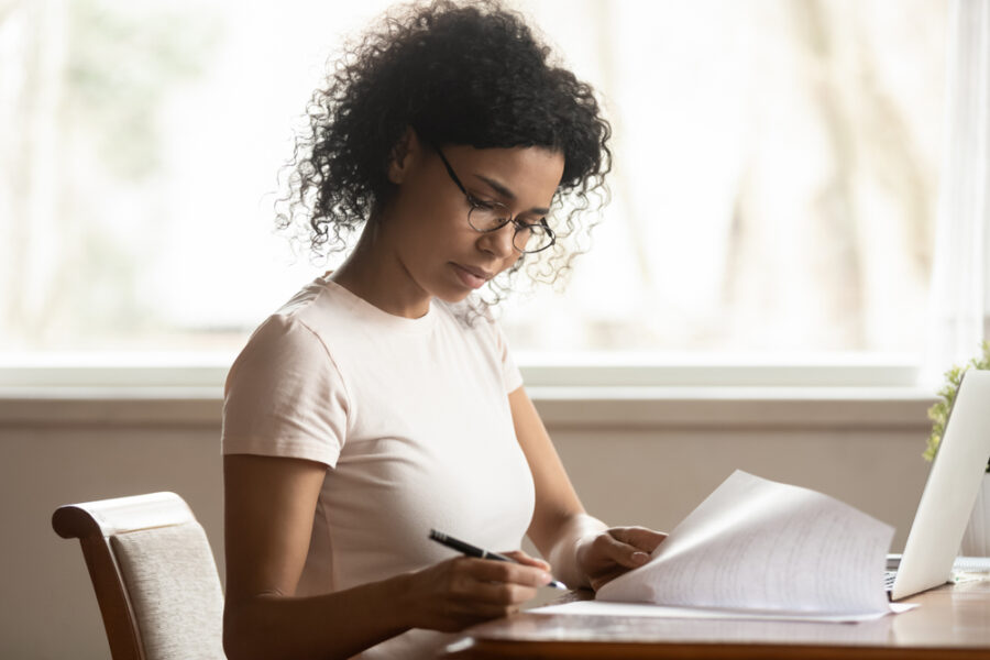 Home Care Medical Social Worker reviews paperwork at her desk