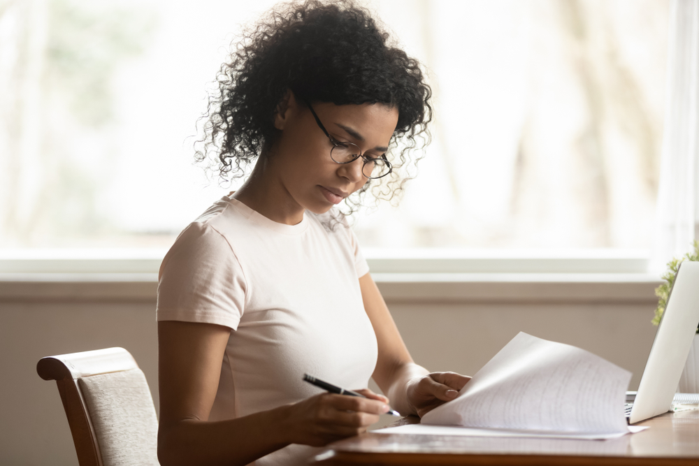 Home Care Medical Social Worker reviews paperwork at her desk
